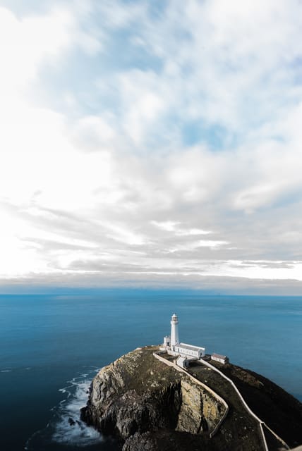 Lighthouse on a headland above open sea