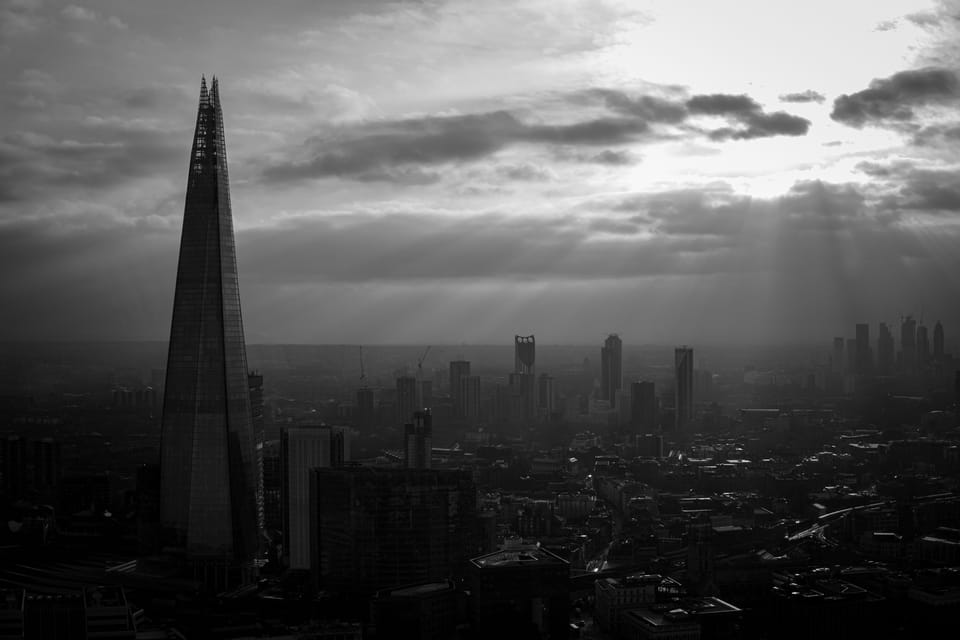 The Shard under shafts of light over London, black and white