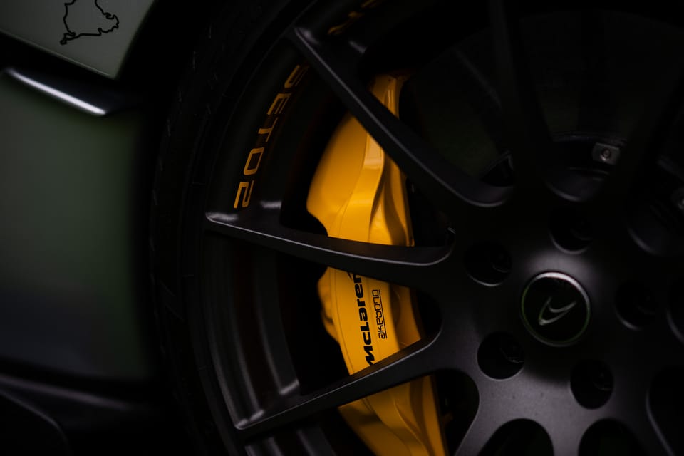 McLaren wheel with a yellow brake caliper